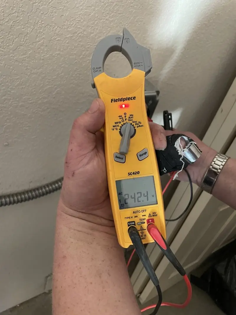 Voltage testing with clamp meter during Ceiling Fan Installation in Stanton